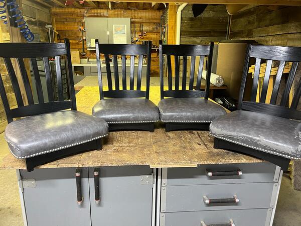 Before: Four nice wooden dining chairs with very worn leather seats