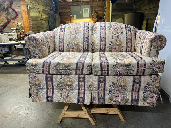 Before: An old loveseat with aging material