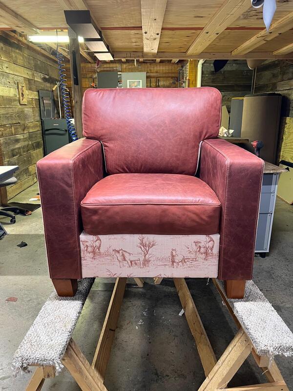 After: A red leather armchair with matching scenic accents