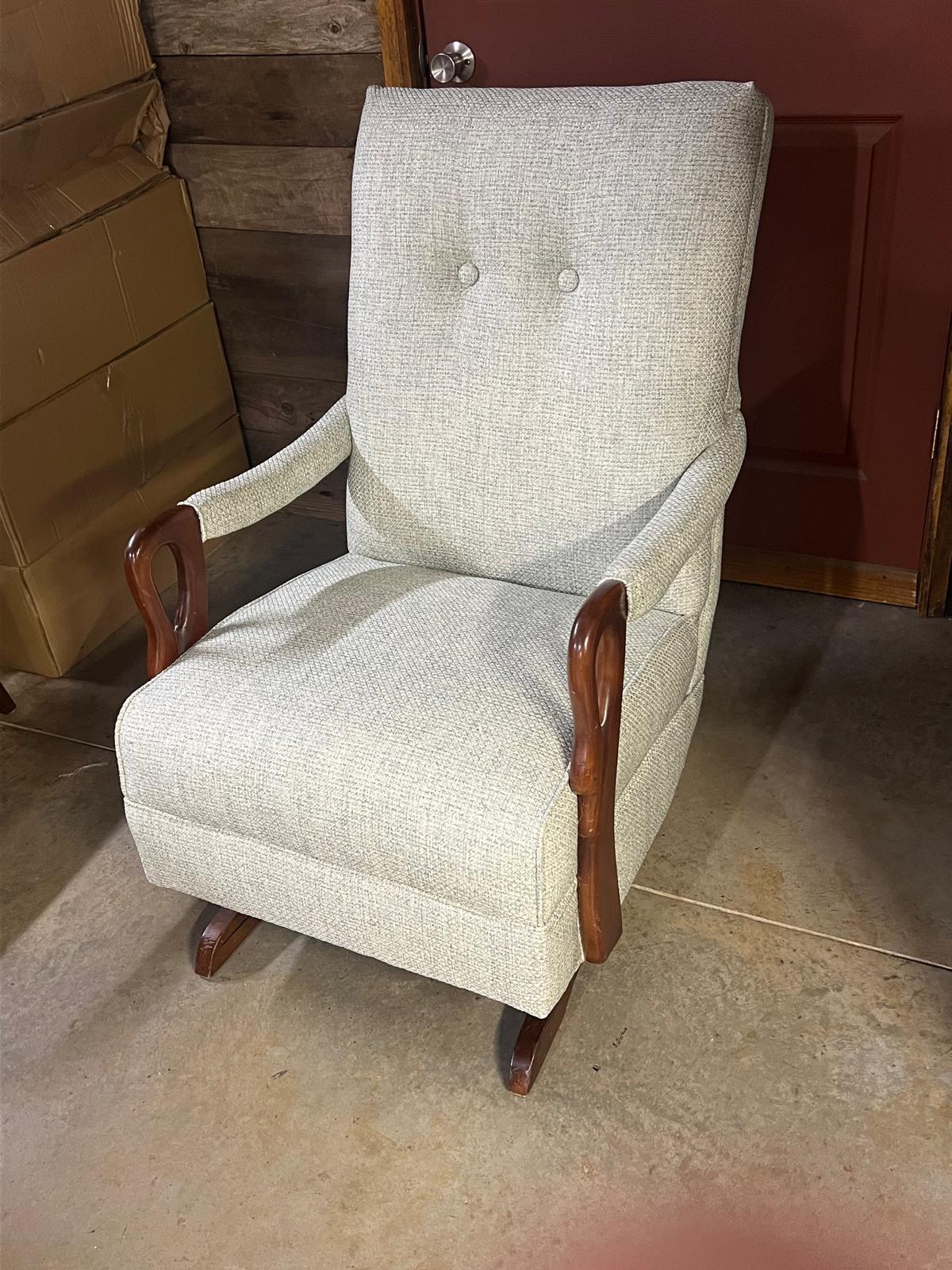 After: Reupholstered rocking chair with wooden gooseneck arms.