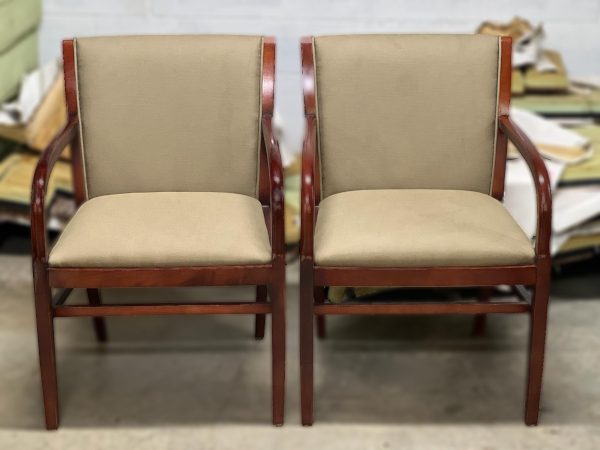 Before: Two business lobby armchairs with stained seats and backs.