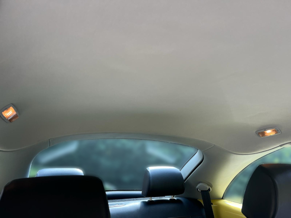 After: A modern Volkswagon Beetle with a clean and wrinkle-free headliner.