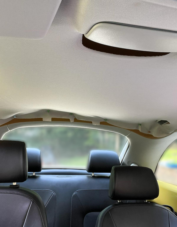 Before: A modern Volkswagon Beetle with a detereorating headliner.