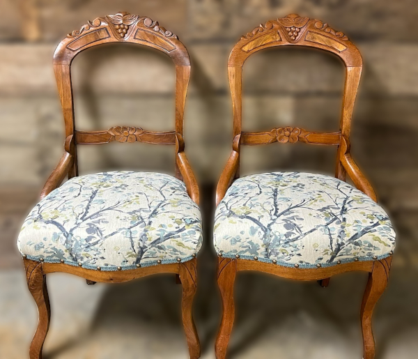 After: Two hand-carved antique family heirloom chairs with lovely new pattern-matched seats.
