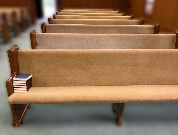 Before: Row of church pews with aging tan covering