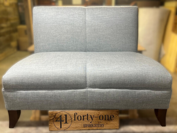 long-standing armless loveseat with new soft fabric